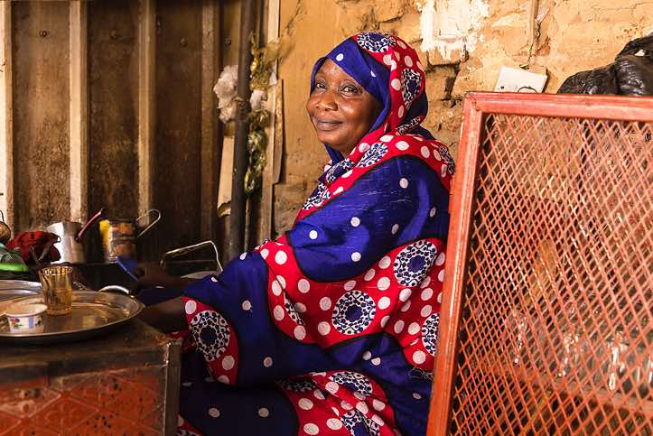 Sudanese woman preparing coffee or tea, Northern Sudan