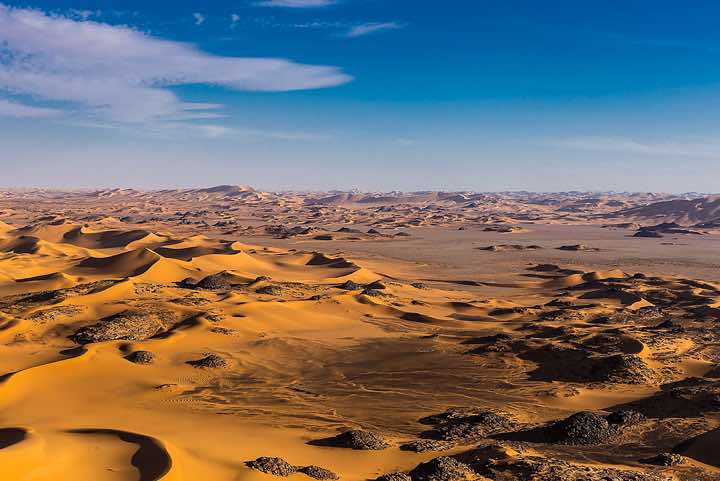 Sand dunes and claypan, southern Oued In Tehak, Tadrart region, Tassili n ́Ajjer National Park, Sahara, North Africa