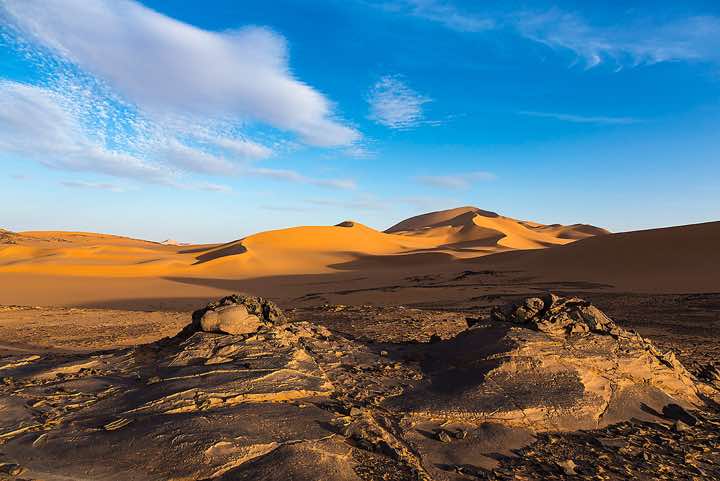 Sand dunes and claypan, southern Oued In Tehak, Tadrart region, Tassili n ́Ajjer National Park, Sahara, North Africa