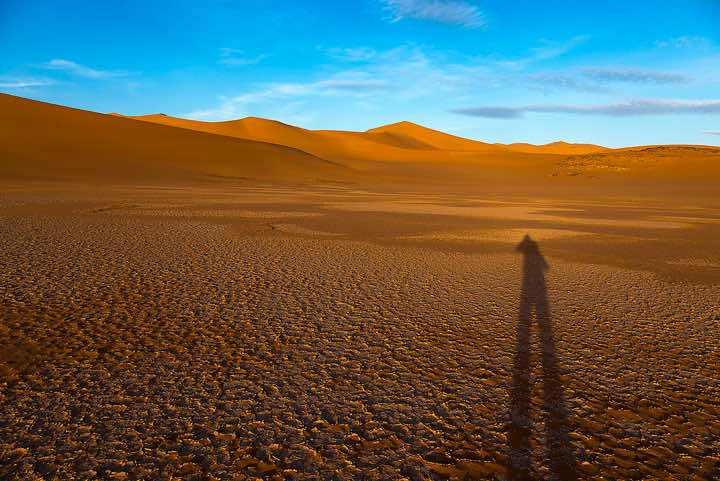 Sand dunes and claypan, southern Oued In Tehak, Tadrart region, Tassili n ́Ajjer National Park, Sahara, North Africa