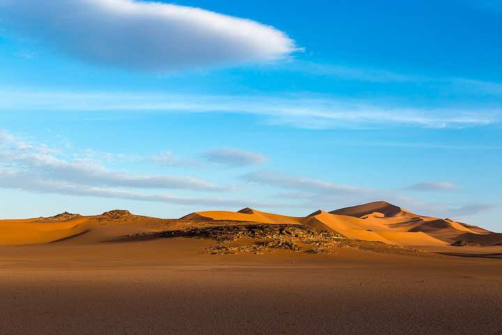 Sand dunes and claypan, southern Oued In Tehak, Tadrart region, Tassili n ́Ajjer National Park, Sahara, North Africa