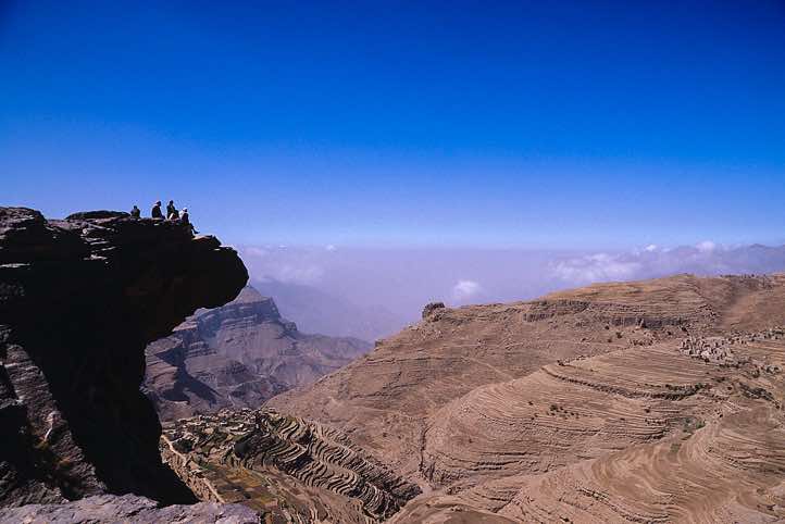 Standing on the edge of a cliff, Yemen mountains