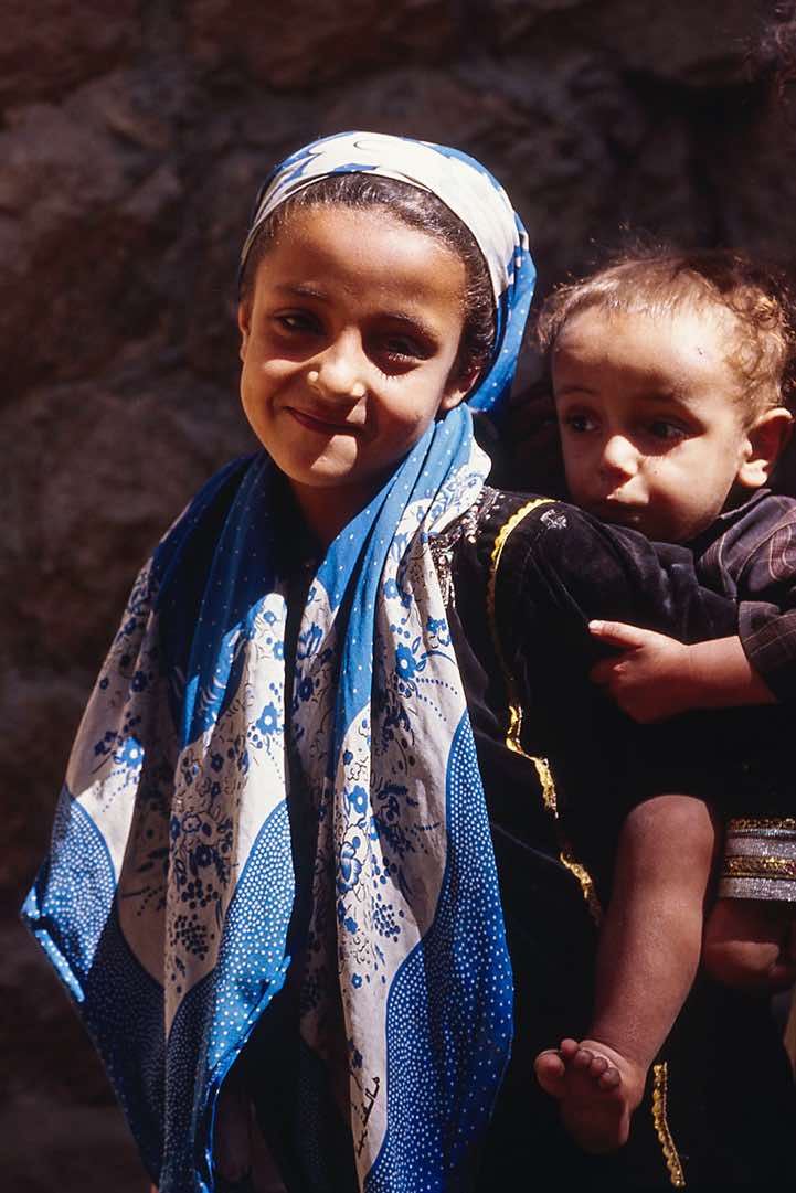 Boy takes a piggyback-ride, Jebel Rugab, Bura mountains
