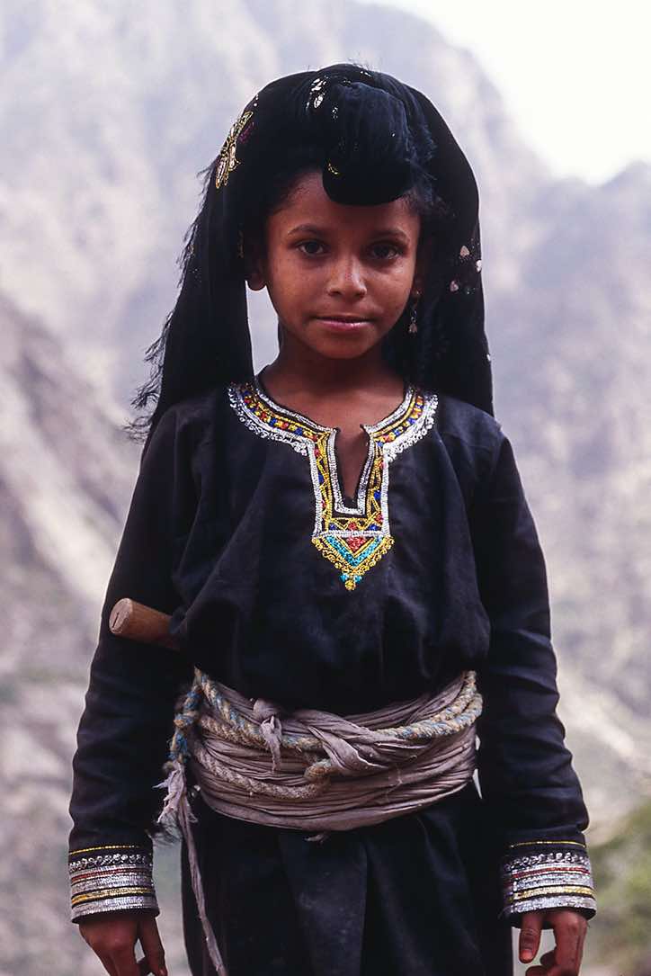 Girl in traditional dress, Jebel Rugab, Bura mountains