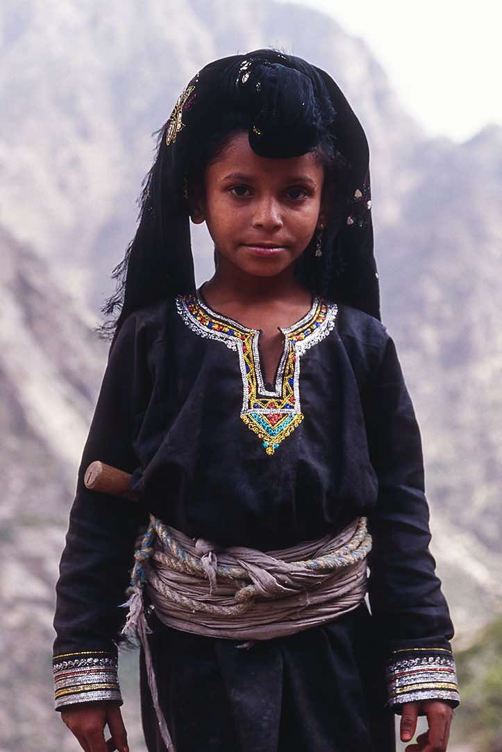 Girl in traditional dress, Jebel Rugab, Bura mountains