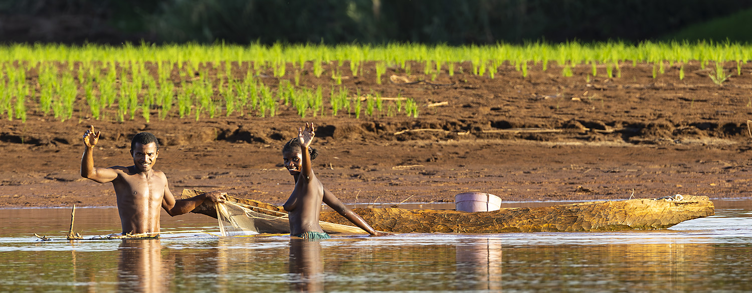 Man and woman fishing in the Tsiribihina River, Madagascar