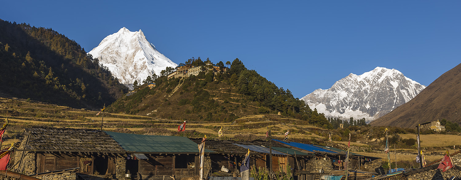 Manaslu, Naike Peak and Gompa, seen from Lho village in Buri Gandaki Valley, Nepal Himalaya